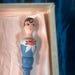 1920s Powder Puff Accessory. Rare carved Flapper Girl on an elongated puff wand. hand painted with original box and marketing insert