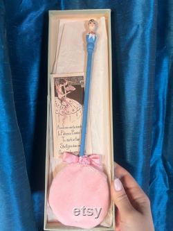 1920s Powder Puff Accessory. Rare carved Flapper Girl on an elongated puff wand. hand painted with original box and marketing insert
