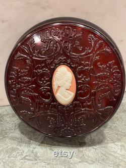 AVON CAMEO BOX Lucite Dark Red Oval Cameo Raised Scroll Design Jewelry Trinket Box Round Dusting Powder Box 1970s 586