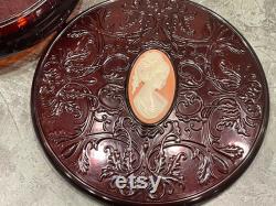 AVON CAMEO BOX Lucite Dark Red Oval Cameo Raised Scroll Design Jewelry Trinket Box Round Dusting Powder Box 1970s 586