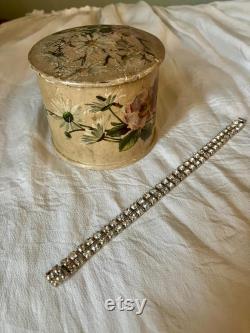 A papier mache powder box and puff, flowers, floral, pink, swan down powder puff.