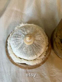 A papier mache powder box and puff, flowers, floral, pink, swan down powder puff.