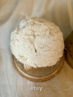 A papier mache powder box and puff, flowers, floral, pink, swan down powder puff.