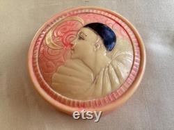 A rare 1920's French celluloid powder box with an embossed Pierrot design