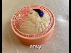 A rare 1920's French celluloid powder box with an embossed Pierrot design
