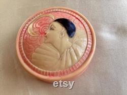 A rare 1920's French celluloid powder box with an embossed Pierrot design