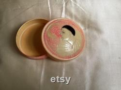 A rare 1920's French celluloid powder box with an embossed Pierrot design