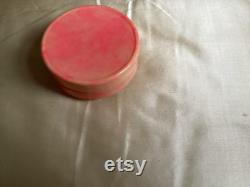 A rare 1920's French celluloid powder box with an embossed Pierrot design