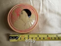 A rare 1920's French celluloid powder box with an embossed Pierrot design
