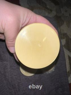An antique carved celluloid powder box