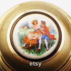 An interesting musical dressing table talcum powder box with mirror.