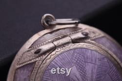 Antique silver compact or pendant with a mirror. Russian silver 84 zolotniks. Purple guilloche enamel. Russian Empire.