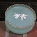 Avon Rapture Beauty Dust Box with Powder Puff plastic powder bowl with lid circa 1960s mint green