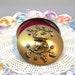 Brilliant Gold VTG Powder Jar Pot Raised Flowers Sparkling Rhinestones Handle