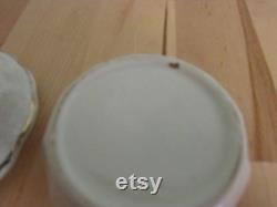 Cute vintage gilt edged porcelain powder jar with two dogs transfer detail