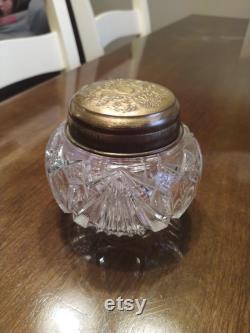 Glass vanity jar with bronze colored lid