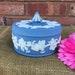 Large round vintage blue lidded Jasperware Wedgwood trinket powder box made in England grapevine design dresser jewelry box