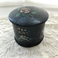 Timeworn antique French powder box with swansdown powder puff