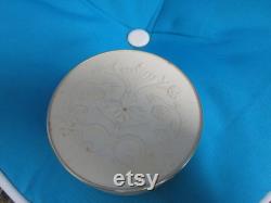 Vintage Avon Round Talc Power Container Hard Plastic Lid with floral design on it