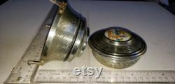 Vintage Metal powder puff holder and powder jar man and woman on top excellent condition