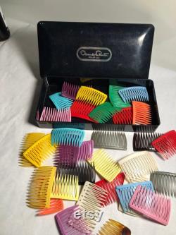 Vintage Oscar De La Renta box with several hair combs.