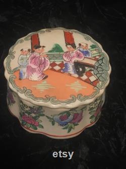 Vintage Porcelain Trinket Box Hand Painted in Macau with Asian Figures on Lid and Multi Colored, Raised, Floral Base.