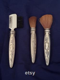 Vintage Powderbox with powder puff, 1 Brush marked Towle Sterling, 1 brush silver handle , 1 eyebrow comb with silver handle