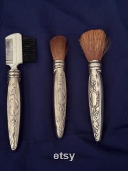 Vintage Powderbox with powder puff, 1 Brush marked Towle Sterling, 1 brush silver handle , 1 eyebrow comb with silver handle
