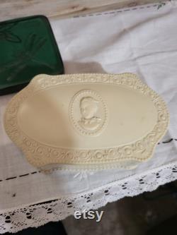 Vintage old plastic powder box with lady on lid.