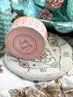 Vintage pink cardboard powder compact