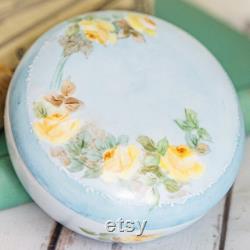 Vintage porcelain powder trinket box, lovely, soft painted yellow roses on a light blue background