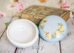 Vintage porcelain powder trinket box, lovely, soft painted yellow roses on a light blue background