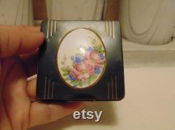 Vintage pre owned small metal powder compact with enameled flowers made by Marathon