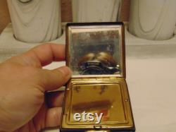 Vintage pre owned small metal powder compact with enameled flowers made by Marathon