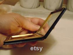 Vintage pre owned small metal powder compact with enameled flowers made by Marathon