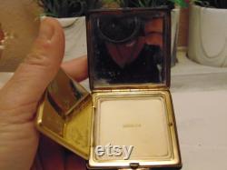 Vintage pre owned small metal powder compact with enameled flowers made by Marathon